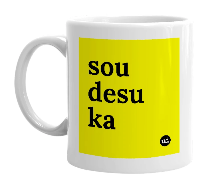 White mug with 'sou desu ka' in bold black letters