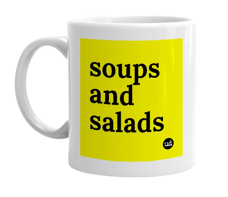 White mug with 'soups and salads' in bold black letters