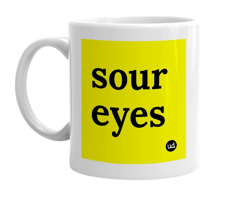 White mug with 'sour eyes' in bold black letters