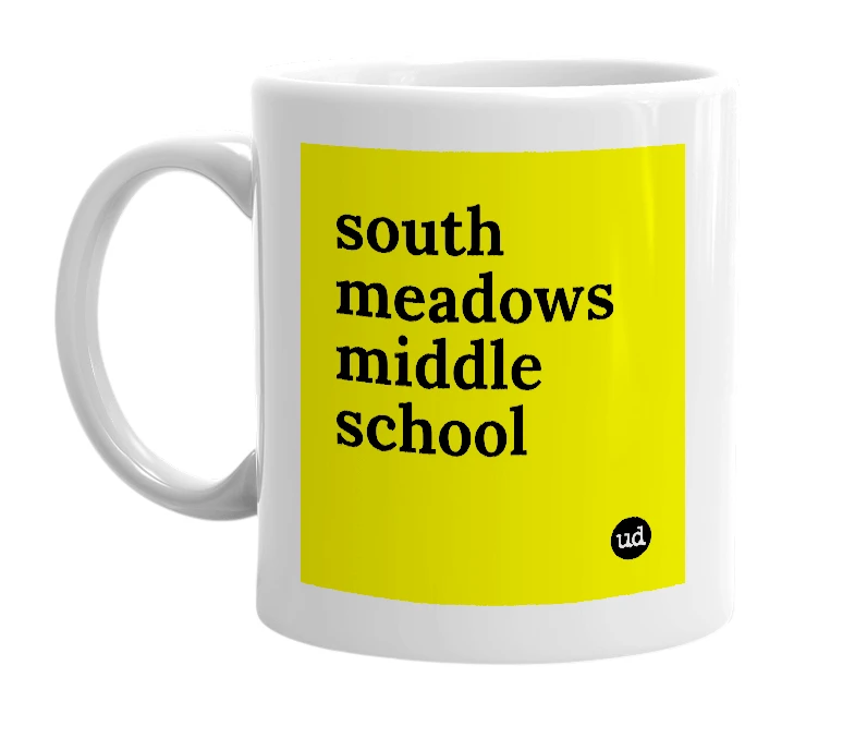 White mug with 'south meadows middle school' in bold black letters