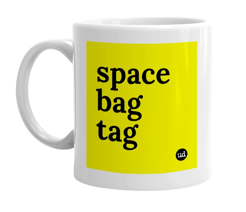 White mug with 'space bag tag' in bold black letters