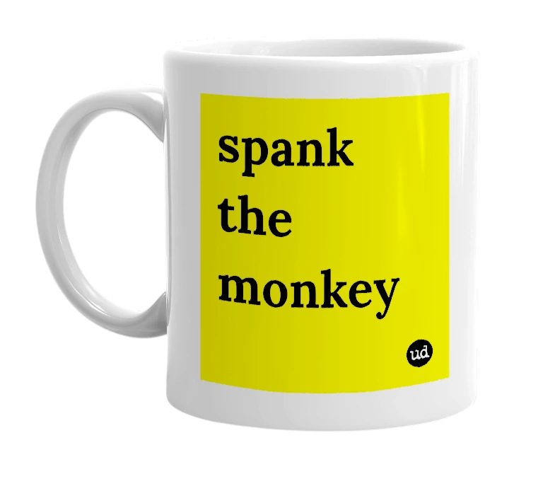 White mug with 'spank the monkey' in bold black letters