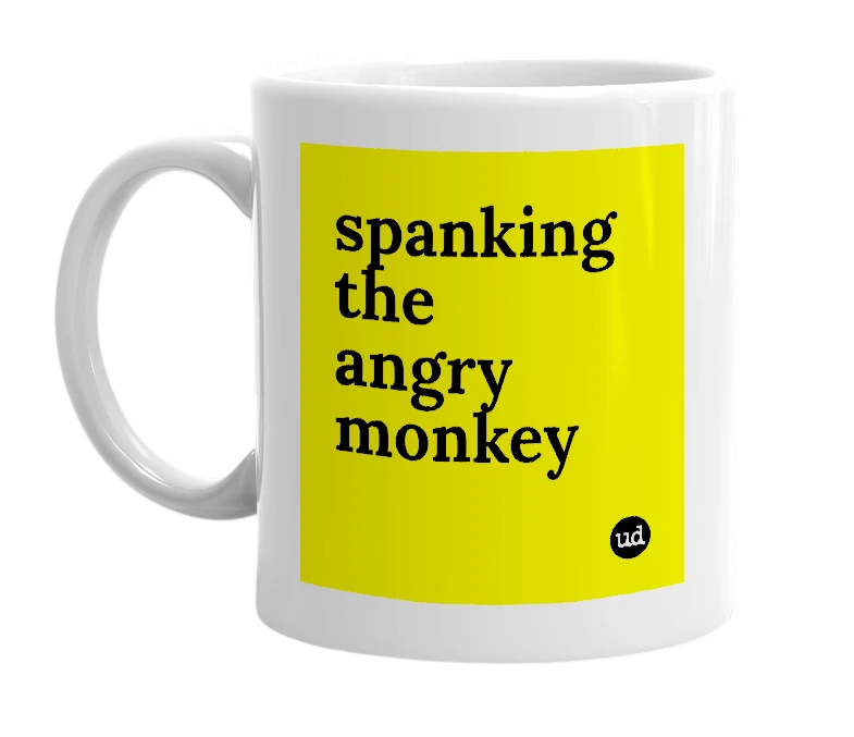 White mug with 'spanking the angry monkey' in bold black letters