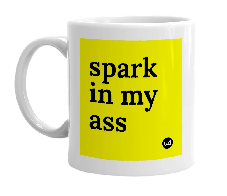 White mug with 'spark in my ass' in bold black letters