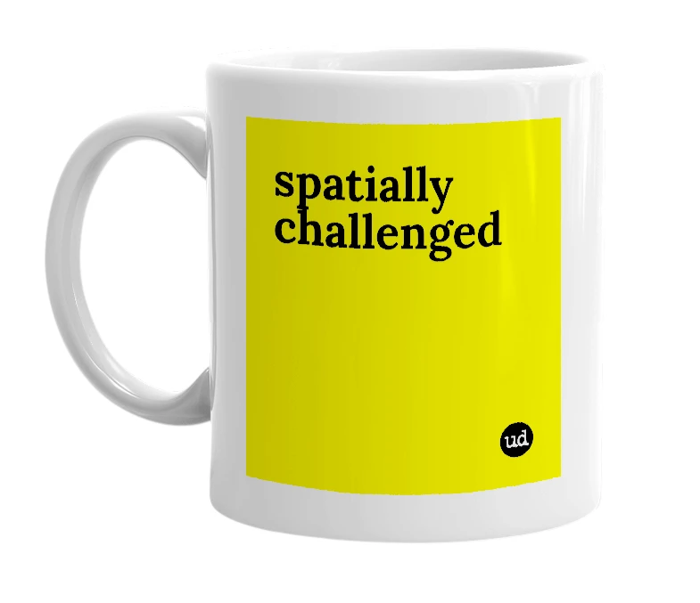 White mug with 'spatially challenged' in bold black letters