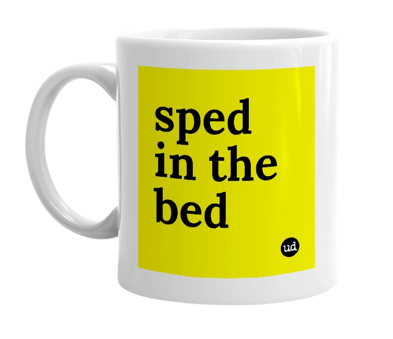 White mug with 'sped in the bed' in bold black letters