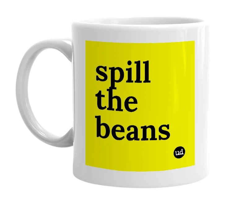 White mug with 'spill the beans' in bold black letters