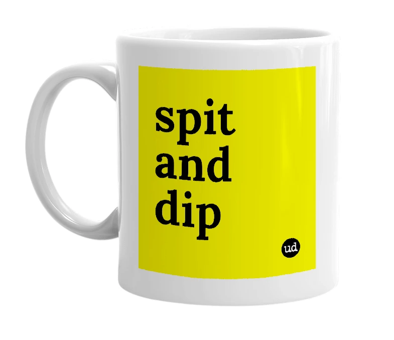 White mug with 'spit and dip' in bold black letters