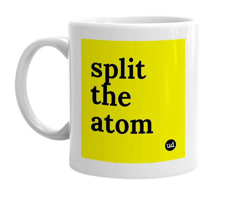 White mug with 'split the atom' in bold black letters