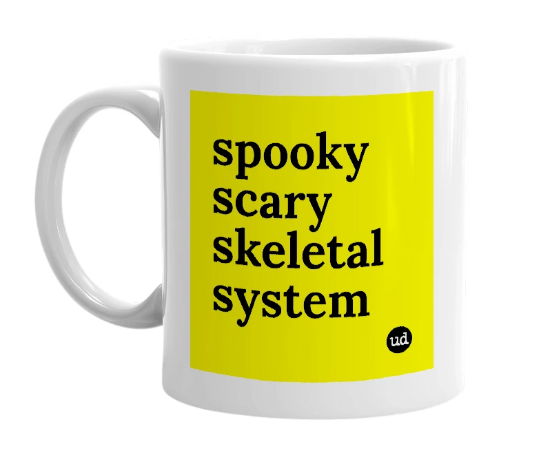 White mug with 'spooky scary skeletal system' in bold black letters