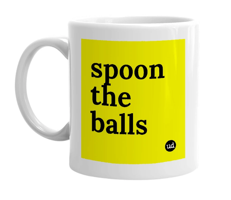 White mug with 'spoon the balls' in bold black letters