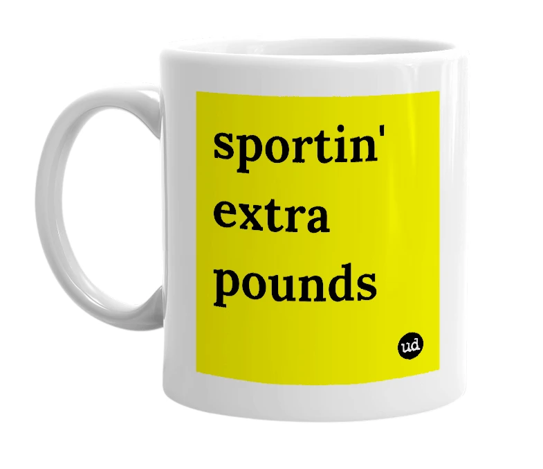 White mug with 'sportin' extra pounds' in bold black letters