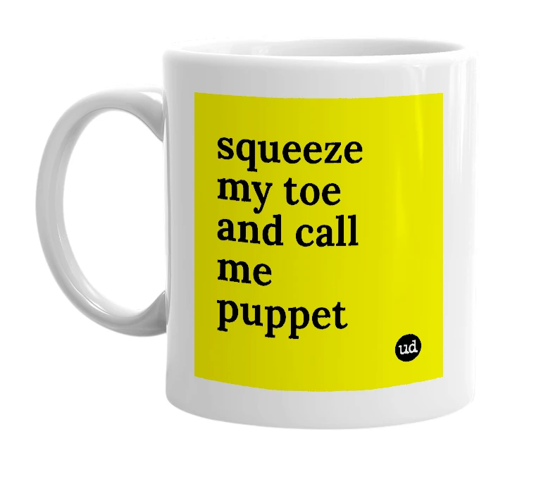 White mug with 'squeeze my toe and call me puppet' in bold black letters