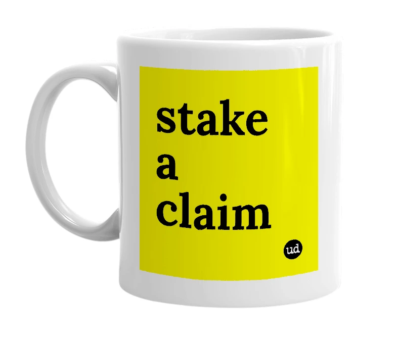 White mug with 'stake a claim' in bold black letters