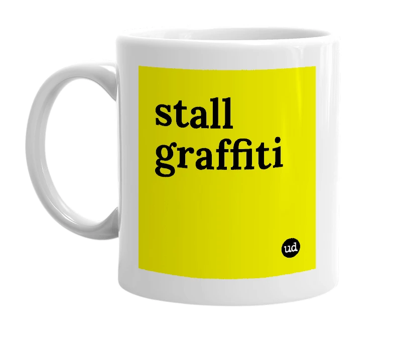 White mug with 'stall graffiti' in bold black letters
