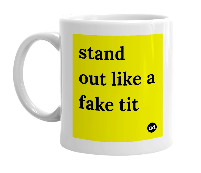 White mug with 'stand out like a fake tit' in bold black letters