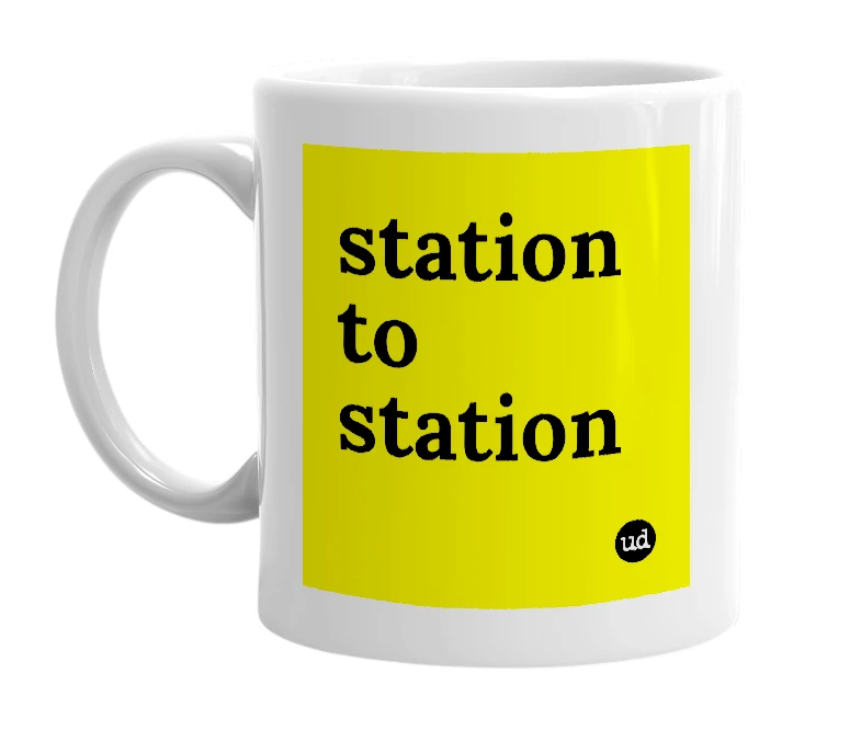 White mug with 'station to station' in bold black letters