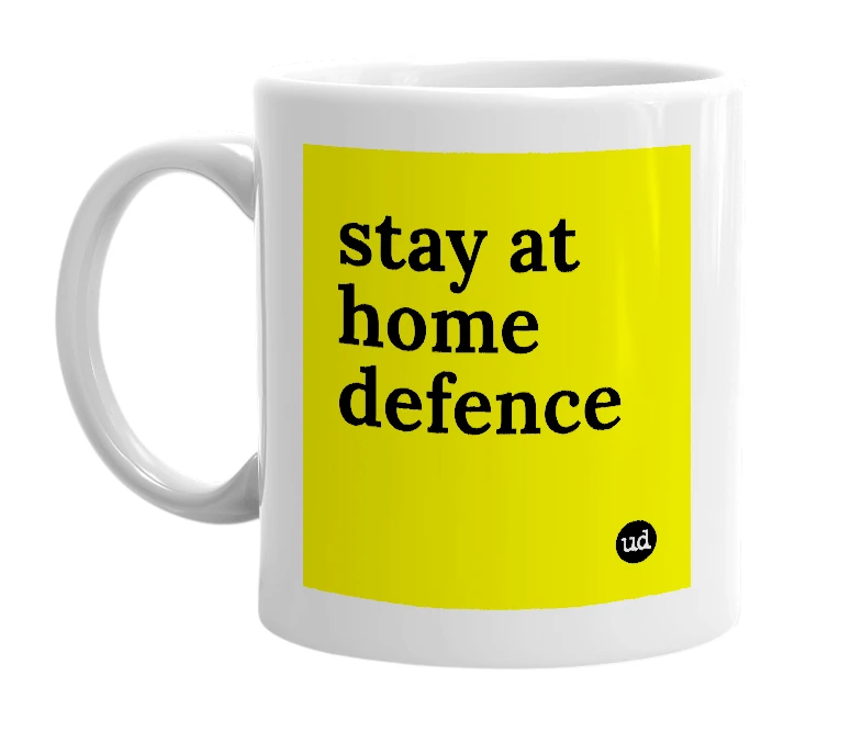 White mug with 'stay at home defence' in bold black letters