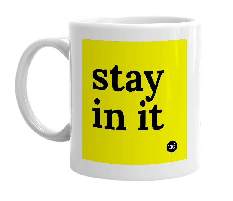 White mug with 'stay in it' in bold black letters