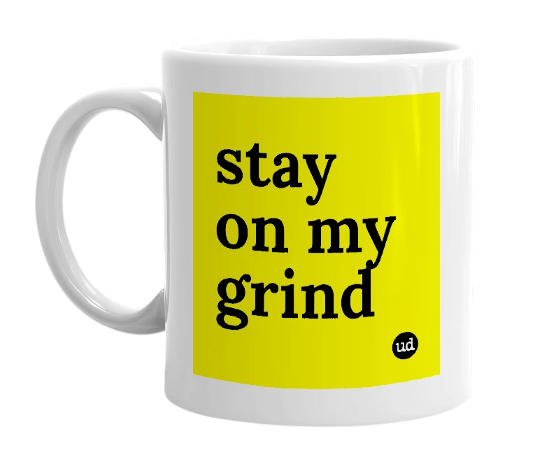 White mug with 'stay on my grind' in bold black letters