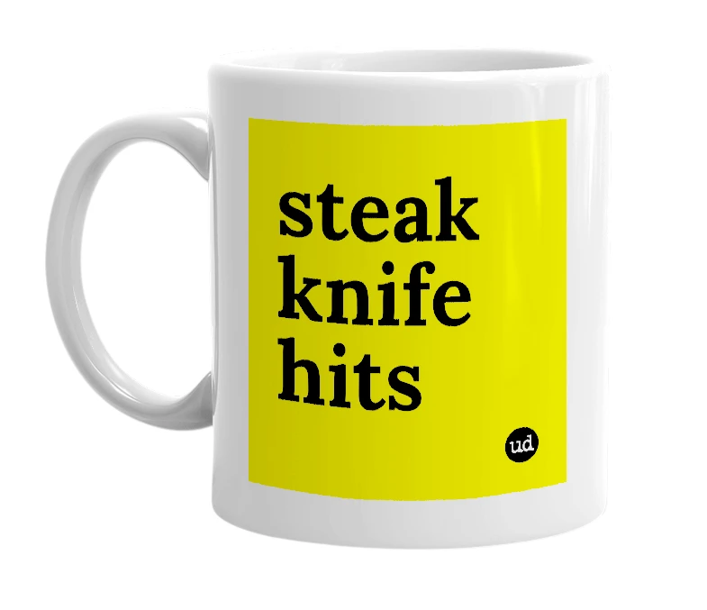 White mug with 'steak knife hits' in bold black letters