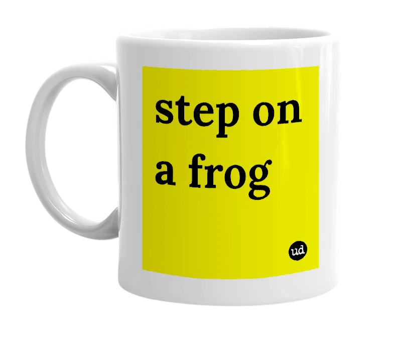 White mug with 'step on a frog' in bold black letters