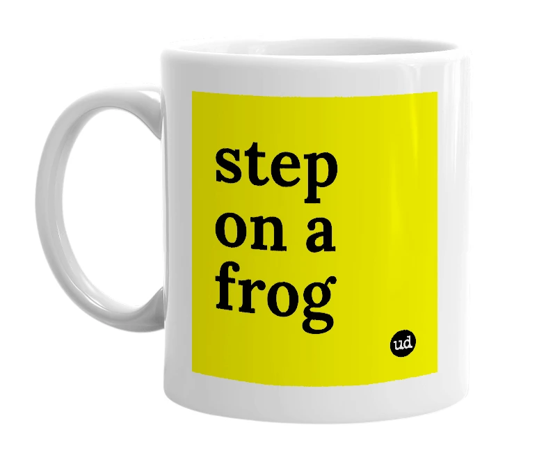 White mug with 'step on a frog' in bold black letters