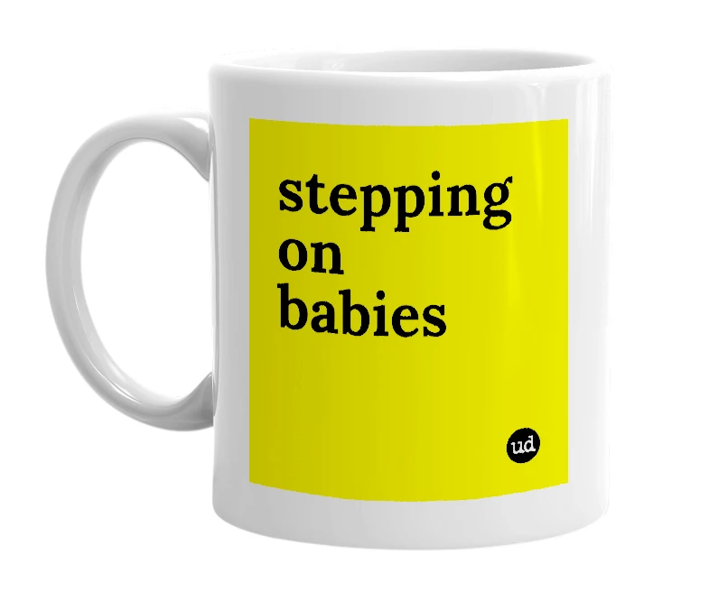 White mug with 'stepping on babies' in bold black letters