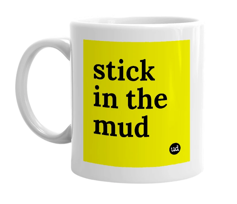 White mug with 'stick in the mud' in bold black letters