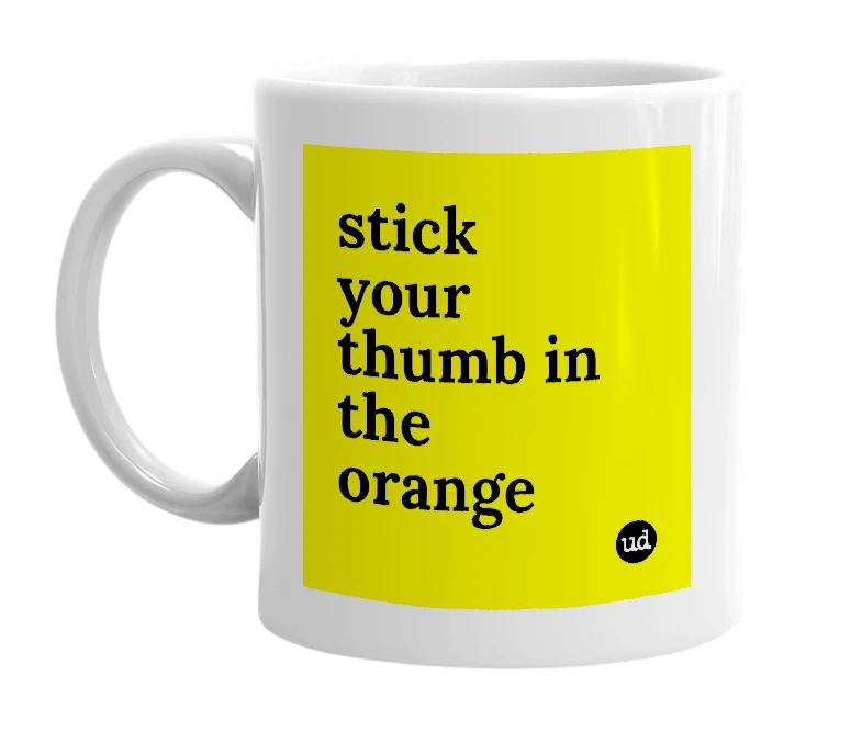 White mug with 'stick your thumb in the orange' in bold black letters