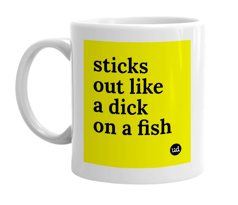 White mug with 'sticks out like a dick on a fish' in bold black letters
