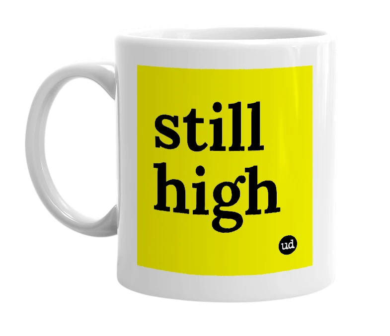White mug with 'still high' in bold black letters