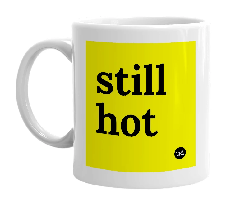 White mug with 'still hot' in bold black letters