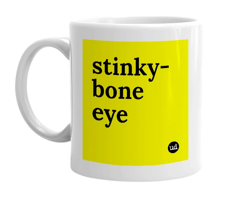 White mug with 'stinky-bone eye' in bold black letters