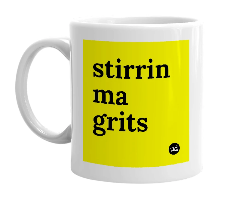 White mug with 'stirrin ma grits' in bold black letters