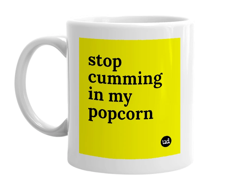 White mug with 'stop cumming in my popcorn' in bold black letters