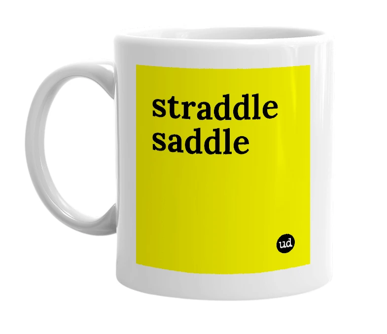 White mug with 'straddle saddle' in bold black letters