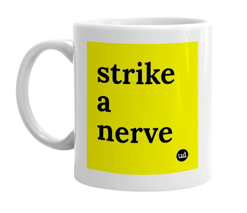 White mug with 'strike a nerve' in bold black letters