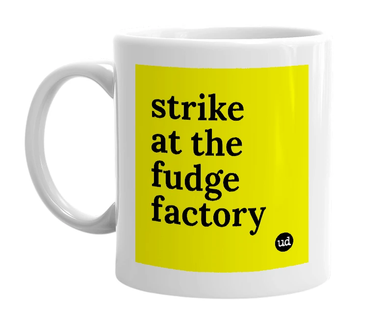 White mug with 'strike at the fudge factory' in bold black letters
