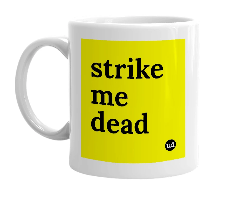 White mug with 'strike me dead' in bold black letters