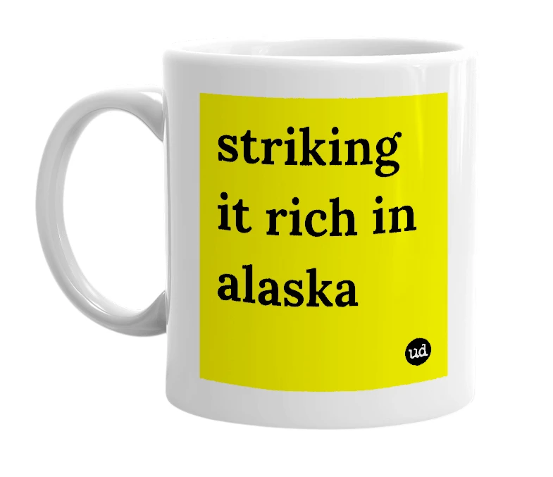 White mug with 'striking it rich in alaska' in bold black letters