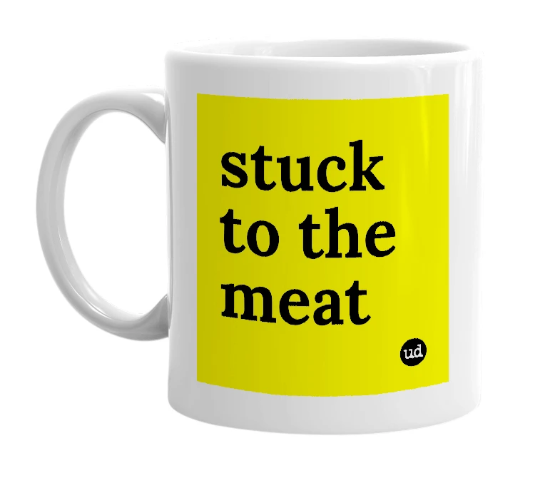 White mug with 'stuck to the meat' in bold black letters