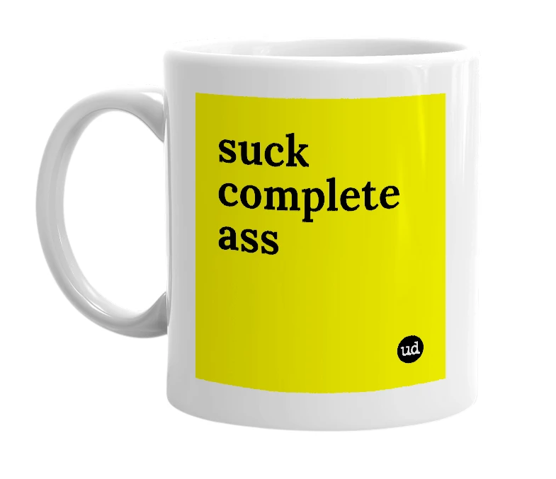 White mug with 'suck complete ass' in bold black letters