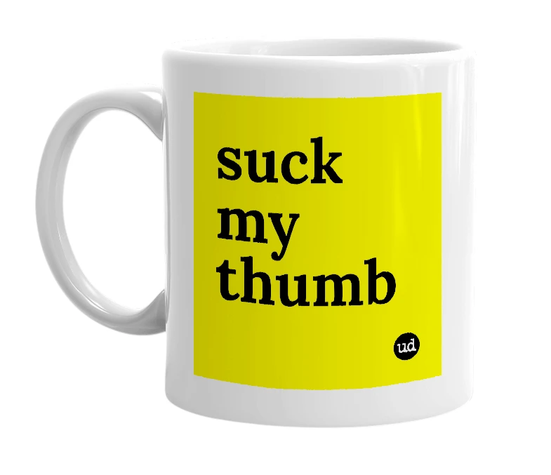White mug with 'suck my thumb' in bold black letters