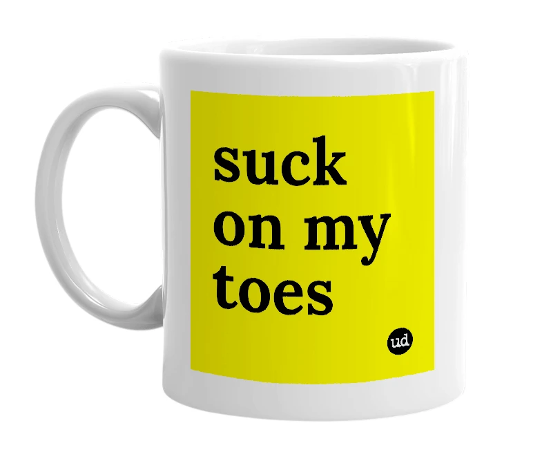 White mug with 'suck on my toes' in bold black letters