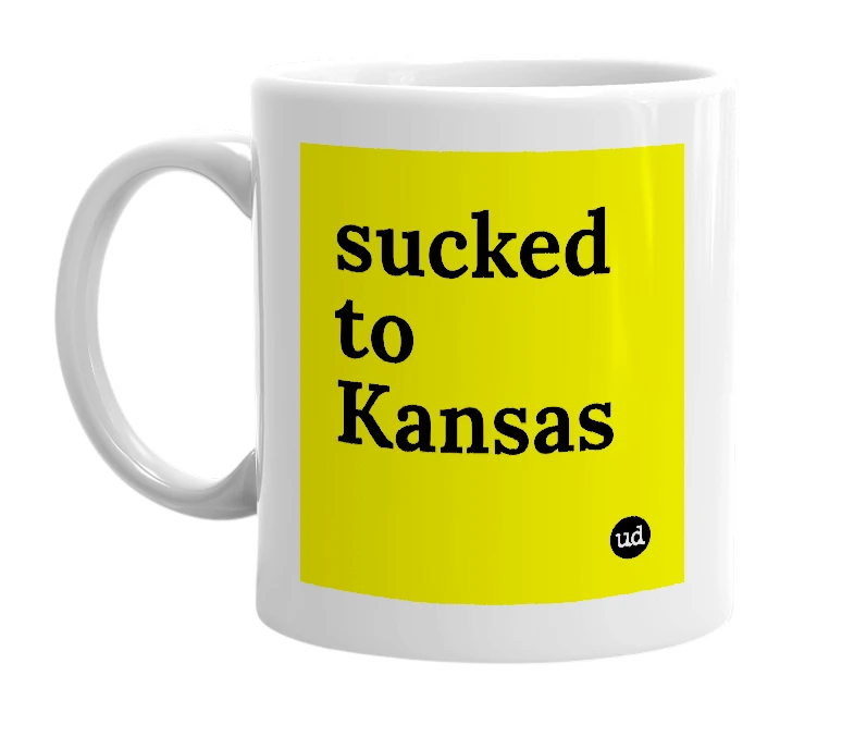 White mug with 'sucked to Kansas' in bold black letters