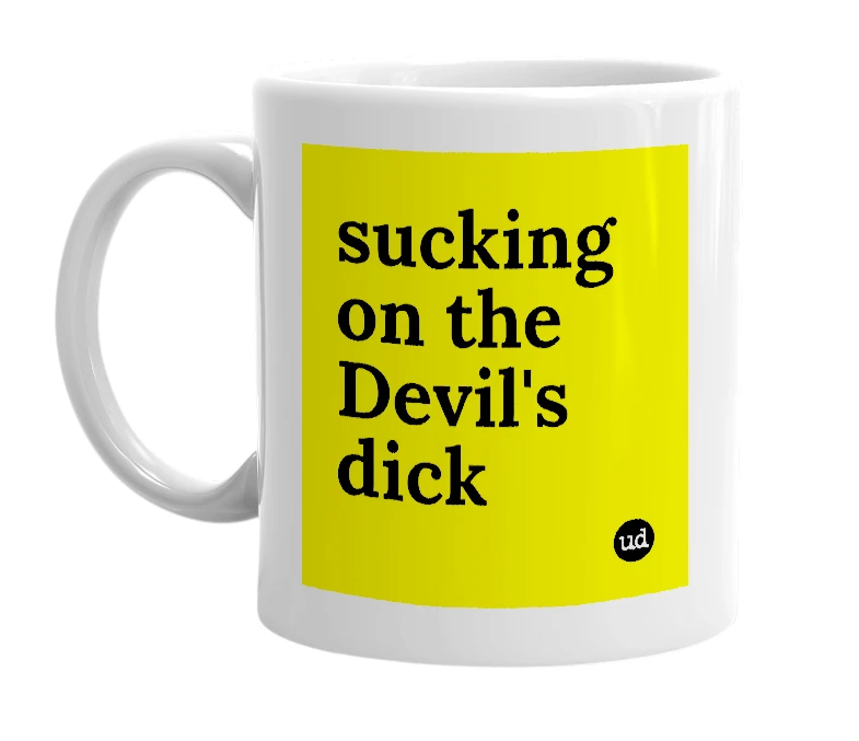 White mug with 'sucking on the Devil's dick' in bold black letters