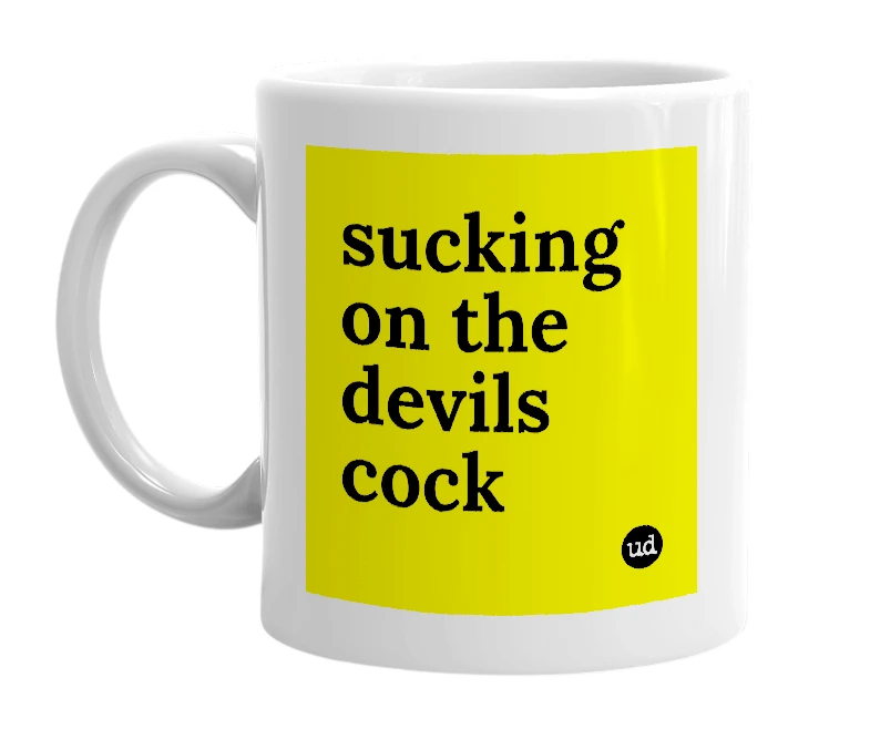 White mug with 'sucking on the devils cock' in bold black letters