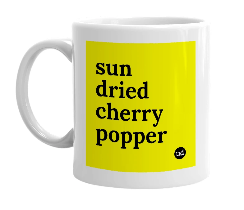 White mug with 'sun dried cherry popper' in bold black letters