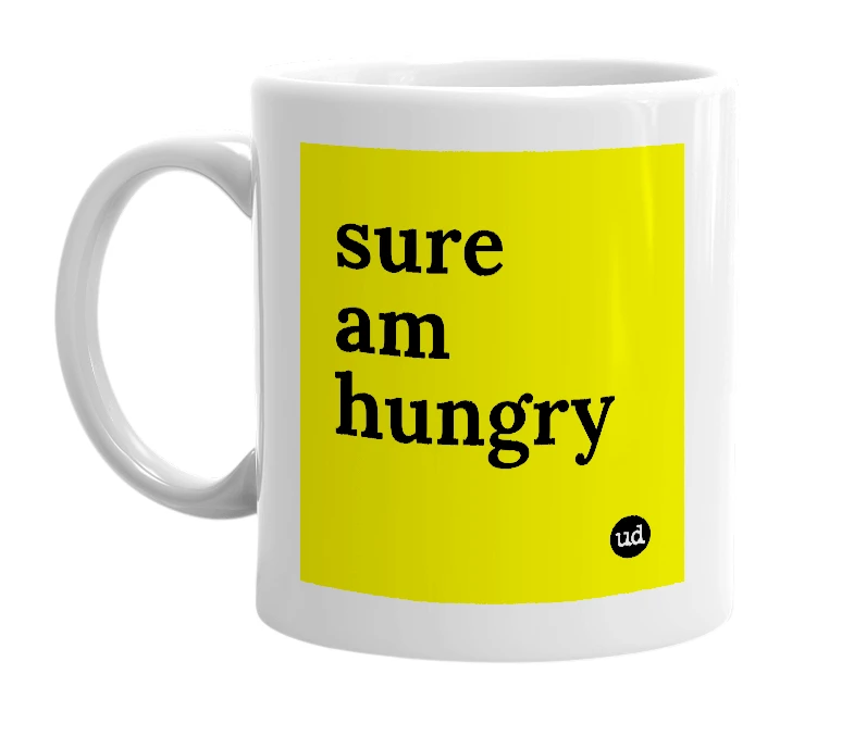 White mug with 'sure am hungry' in bold black letters